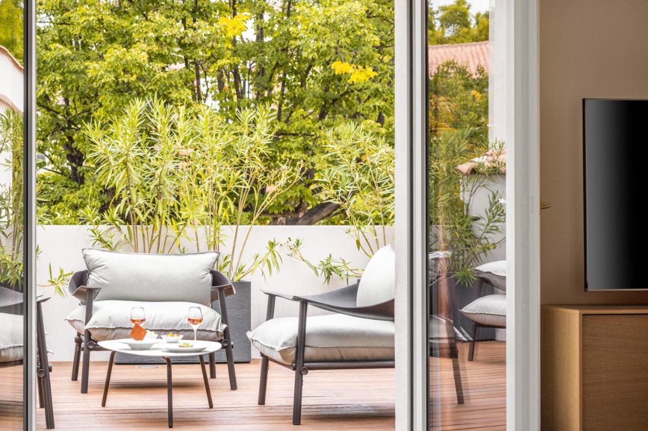 Maison Albar Hotels L'Imperator Nimes Exterior foto A sliding door